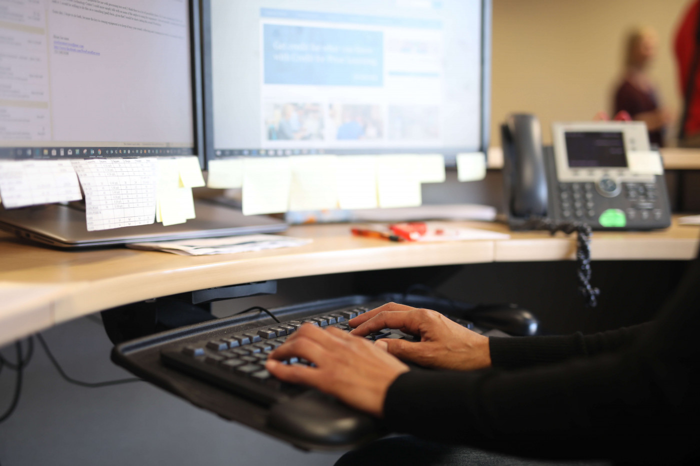 Hands typing on keyboard