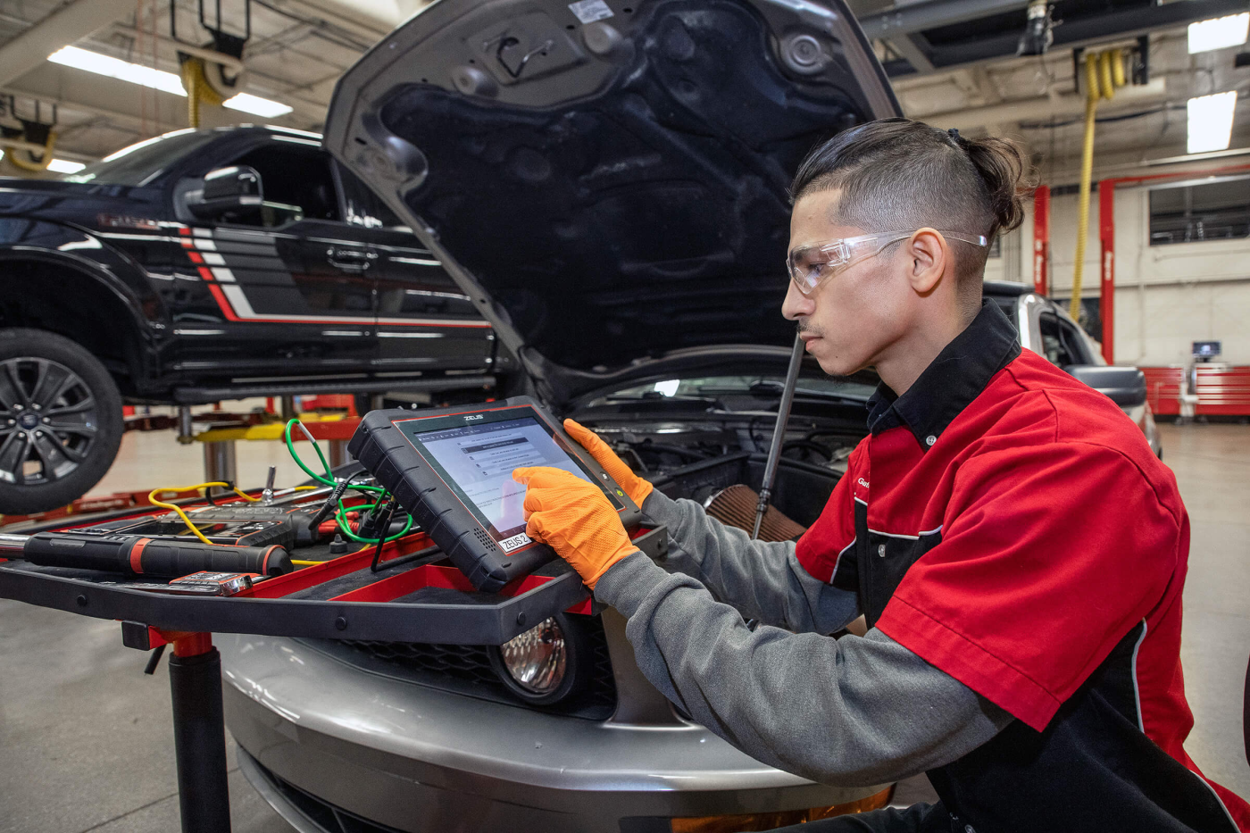 Automotive Technician Student working on car