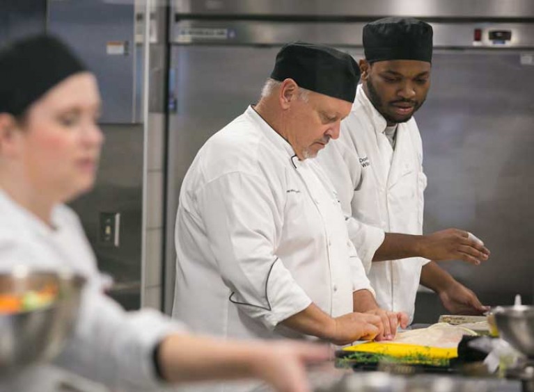 Chefs working in kitchen