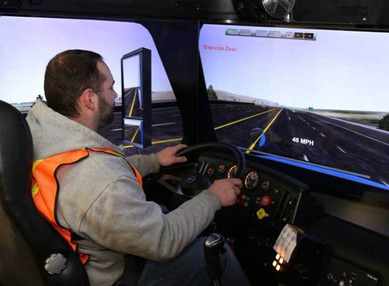 Student using driving simulator