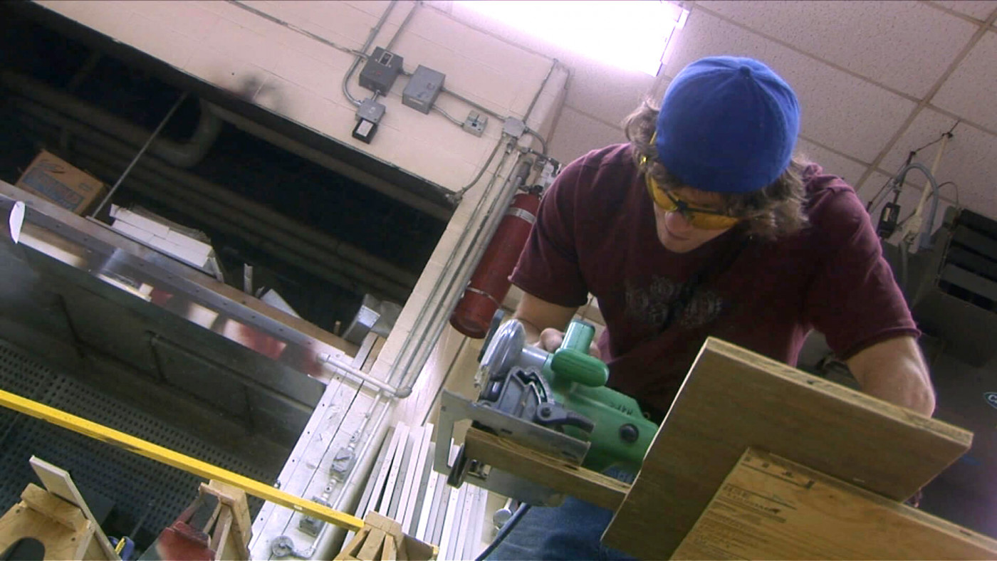 Student using an electric saw