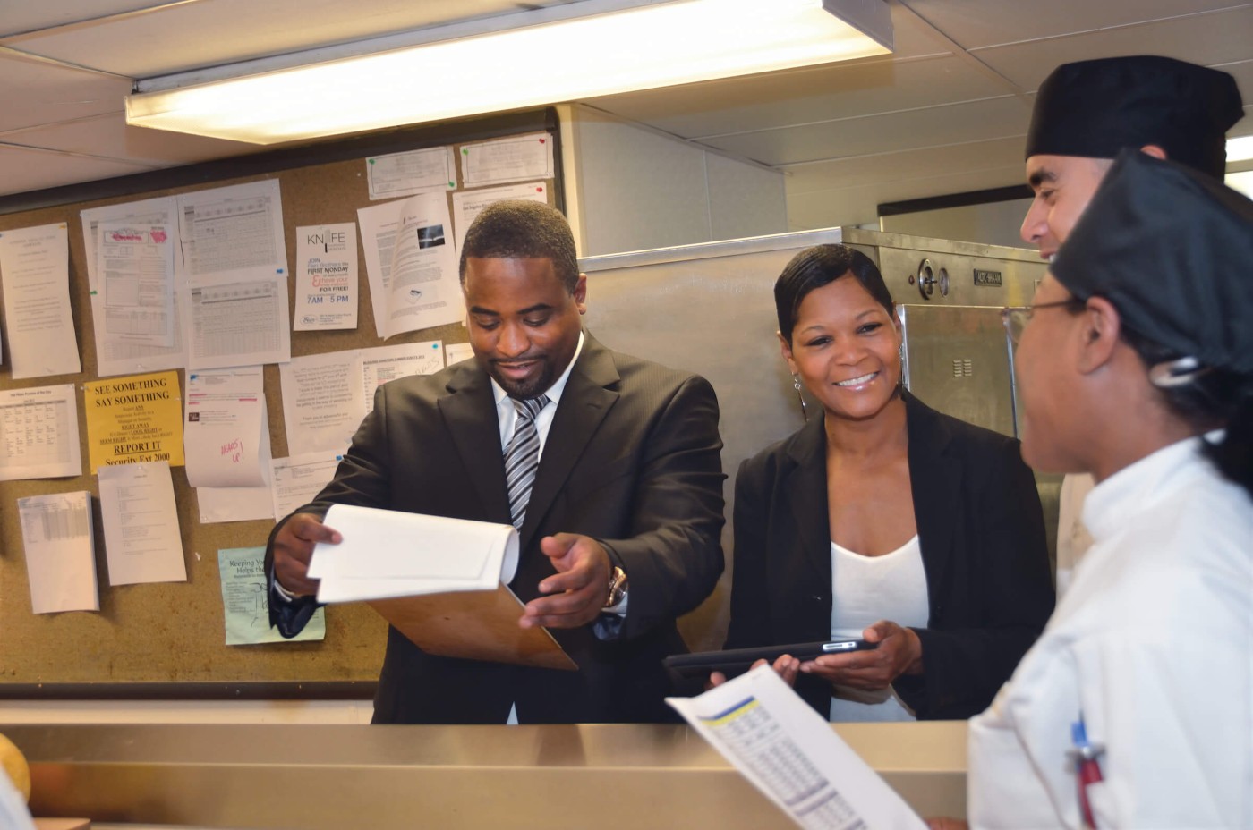 Hospitality managers with staff