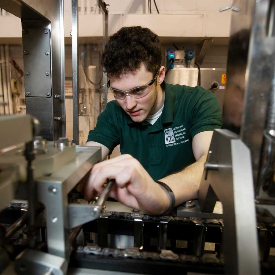 Student with machine on campus