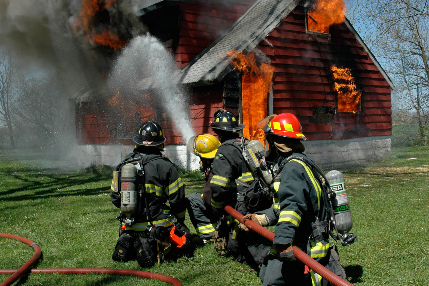 Fire crew dousing a fire 