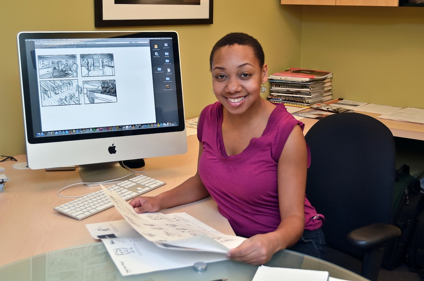 Graphic design staff member at desk