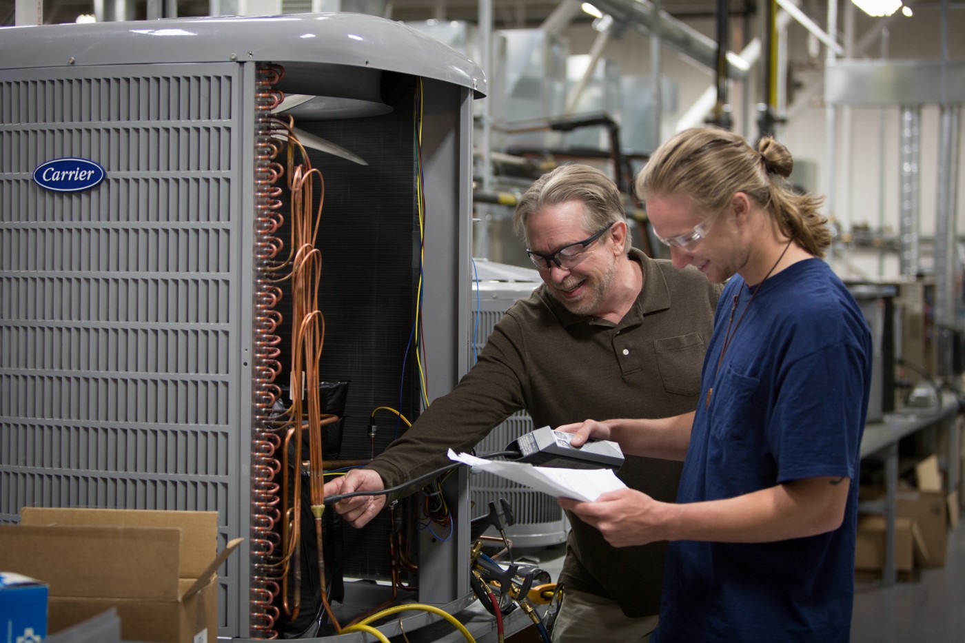 HVAC student checking equipment