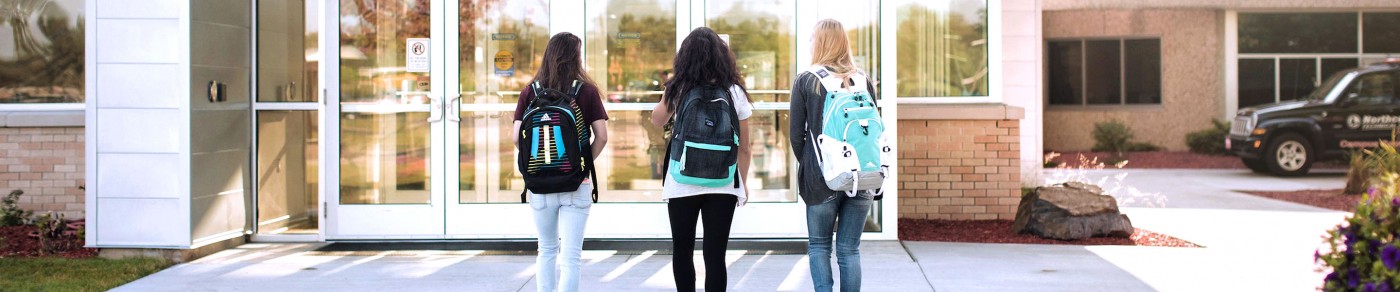 Students walking towards school entrance