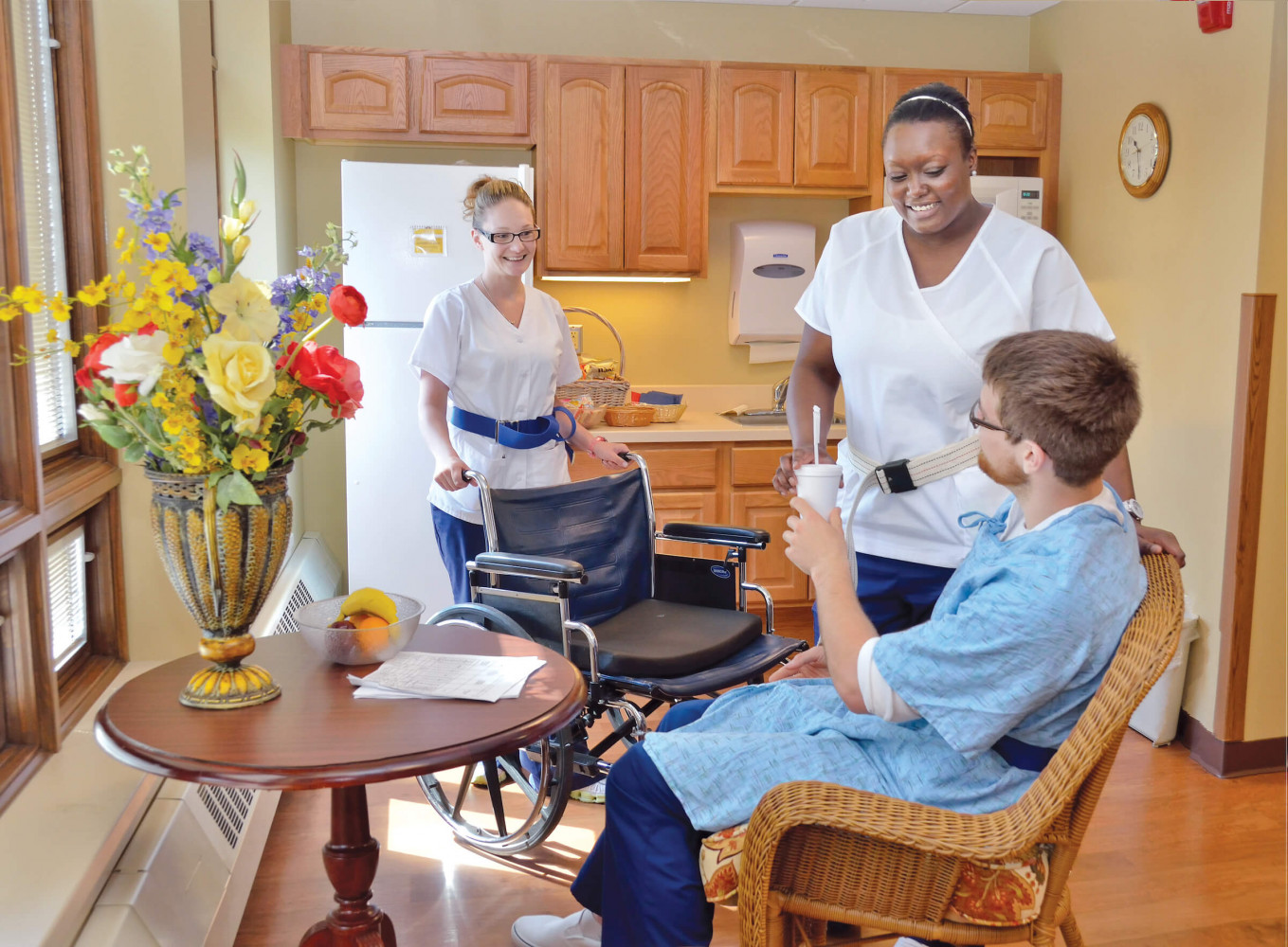 Nursing assistants preparing to transfer patient