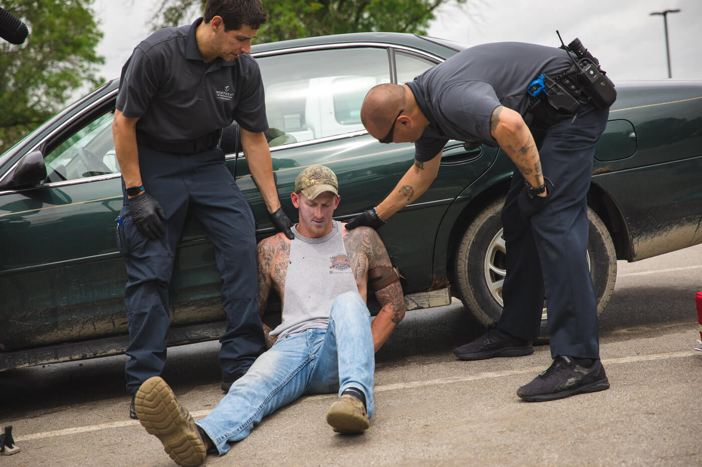 Two criminal justice students simulate an arrest 