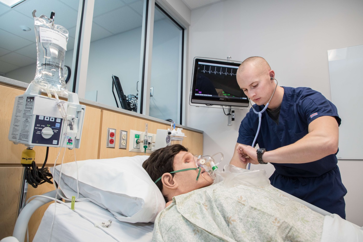 Nursing student with simulated patient