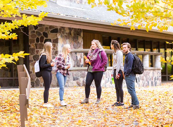 Students talking outside on campus