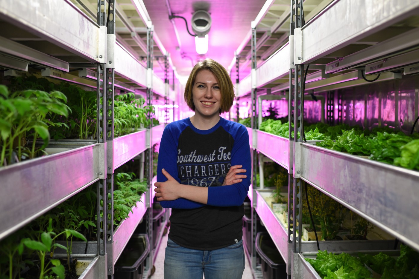 Ag student in greenhouse