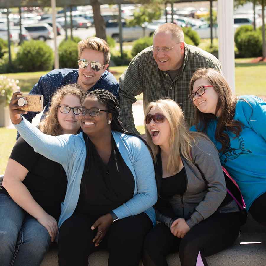 Students or staff taking selfie together