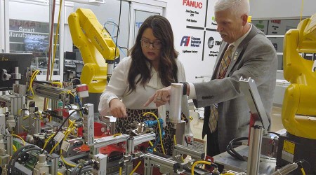 Student and instructor looking at machinery