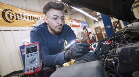 Lupe Jaramillo fixing car