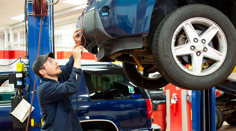 success stories flex automotive student working on car