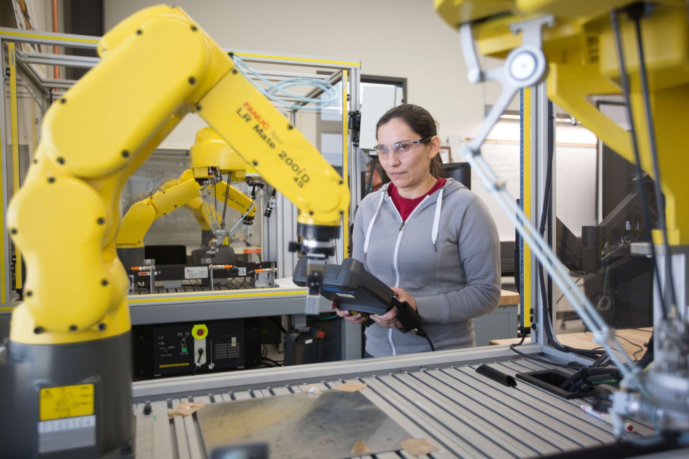 woman using programmable logic controllers (PLCs)