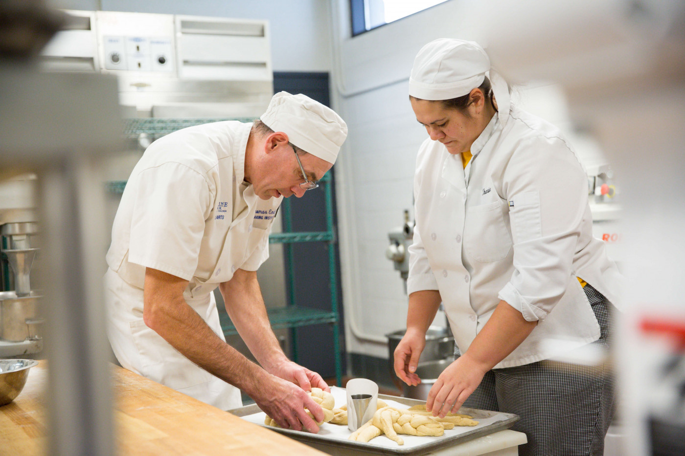 Culinary assistant helps out in the commercial kitchen