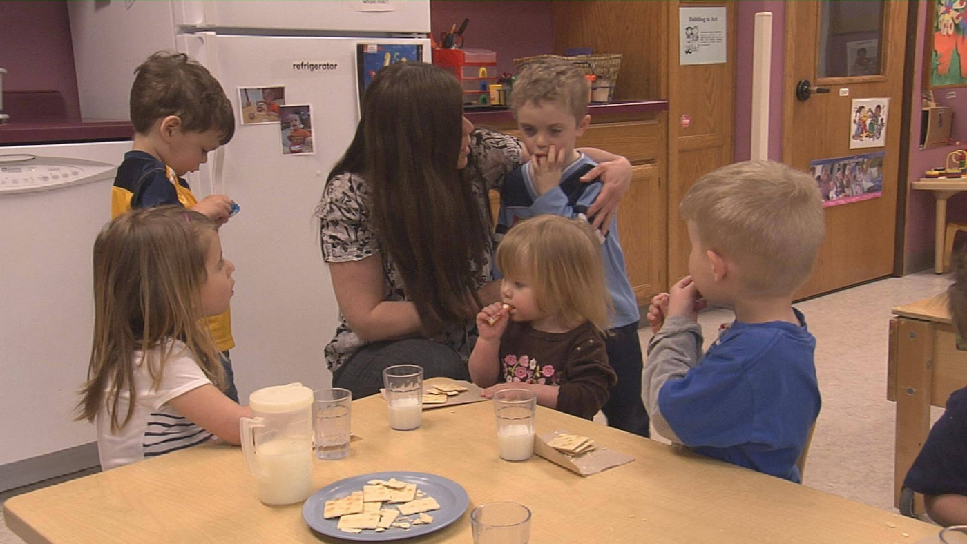 Early Childhood teacher and students interacting