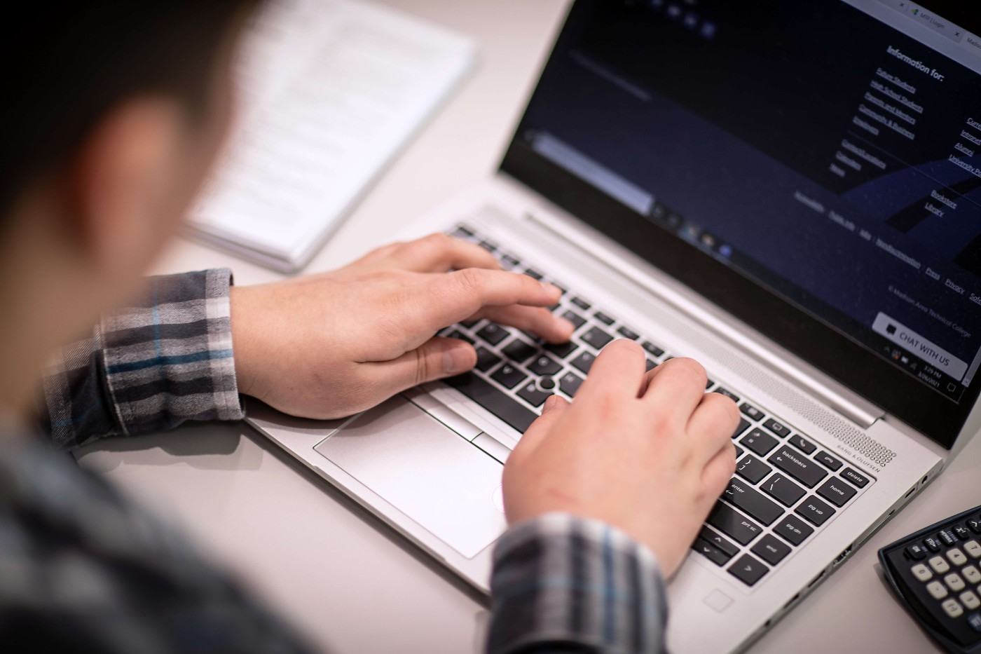 Person doing work on a laptop