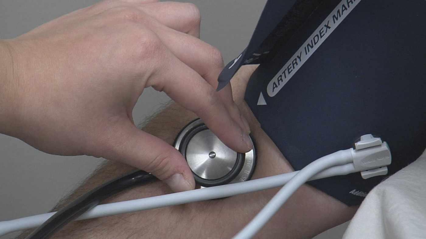 medical assistant checking vitals