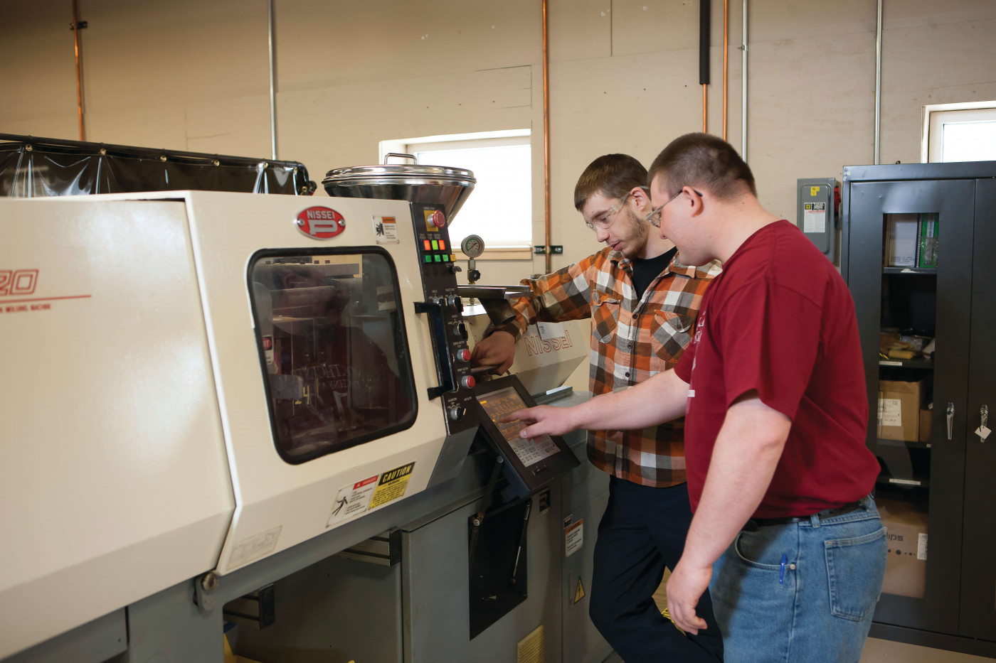 machinist student making adjustments