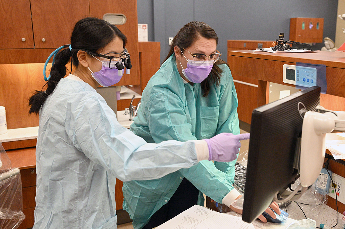 Student and Supervisor in a lab 